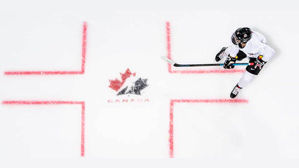 player on ice with logo