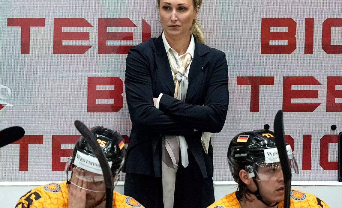 A TV reporter asked the trailblazing female coach of Team Germany what it was like to be a 'beautiful woman' on a hockey team 'full of handsome men'