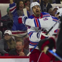 Rangers left wing Chris Chreider (left) is congratulated by defenseman Adam Fox after scoring against the Hurricanes during the third period in Raleigh, North Carolina, on Monday. | USA TODAY / VIA REUTERS