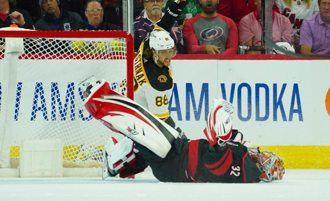Hurricanes goalie Antti Raanta knocked out of game after hit by Bruins' David Pastrnak
