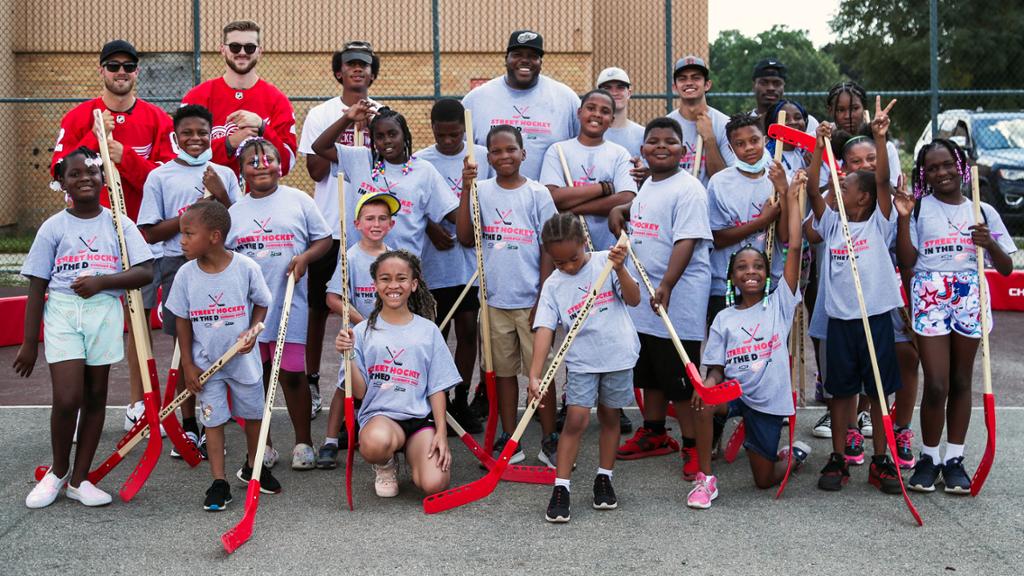 Oesterle and Rasmussen teach Detroit youth at Summer Street Hockey event