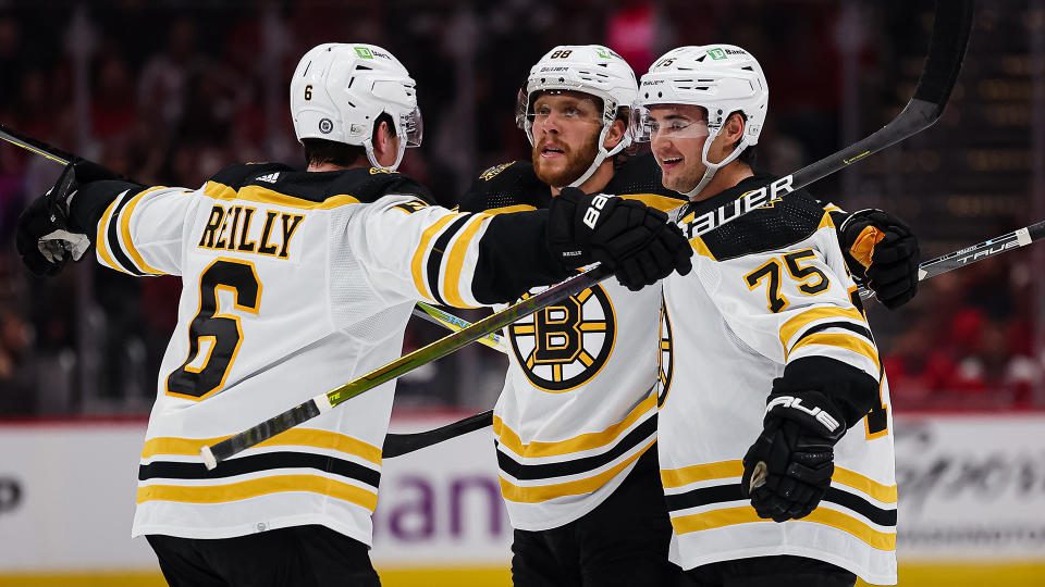 David Pastrnak (middle) has been producing at an MVP pace for the Bruins so far. (Photo by Scott Taetsch/Getty Images)