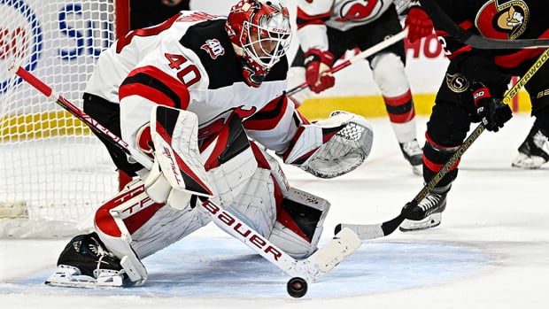 Schmid backstops Devils to 12th straight win with 25 saves against stumbling Senators