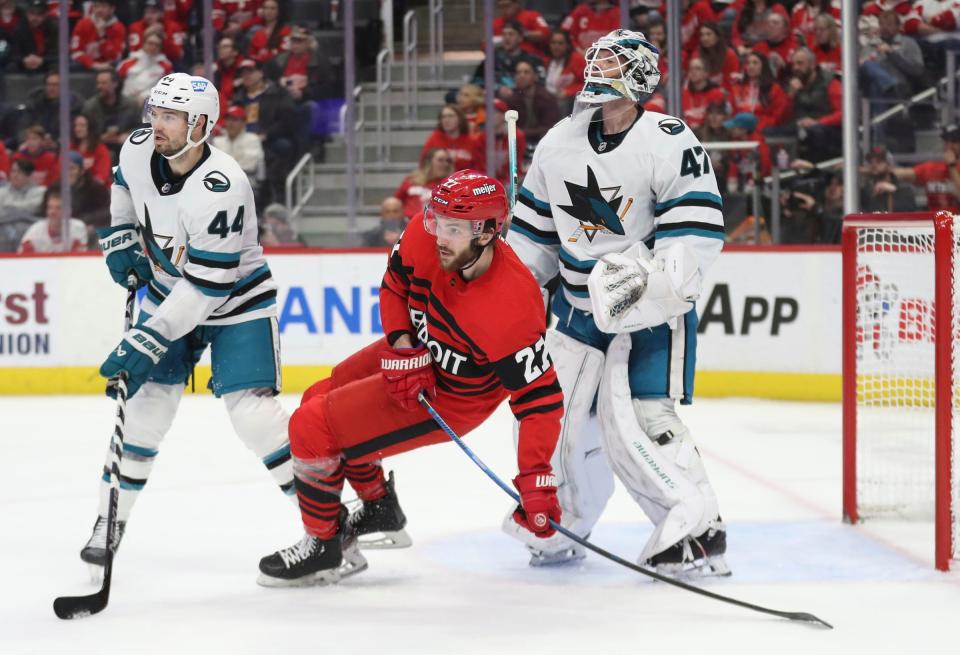 Detroit Red Wings center Michael Rasmussen (27) looks for a shot against San Jose Sharks defenseman Marc-Edouard Vlasic (44) and goaltender James Reimer (47) during first period action Tuesday, January 24, 2023.