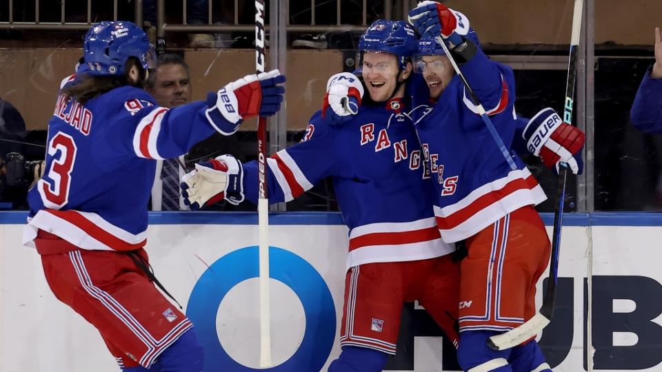 Jan 23, 2023; New York, New York, USA; New York Rangers defenseman Adam Fox (23) celebrates his goal against the Florida Panthers with center Mika Zibanejad (93) and left wing Artemi Panarin (10) during the first period at Madison Square Garden.