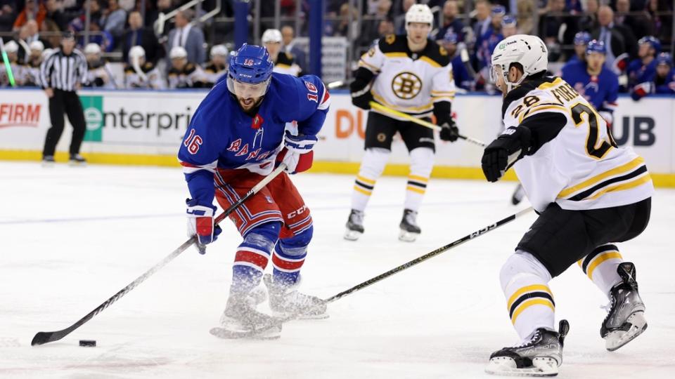 Jan 19, 2023; New York, New York, USA; New York Rangers center Vincent Trocheck (16) brings the puck up ice against Boston Bruins defenseman Derek Forbort (28) during the second period at Madison Square Garden.