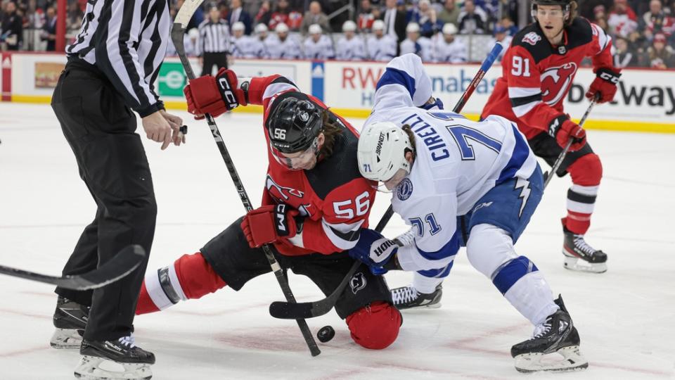Mar 14, 2023; Newark, New Jersey, USA; New Jersey Devils left wing Erik Haula (56) faces off against Tampa Bay Lightning center Anthony Cirelli (71) during the first period at Prudential Center.