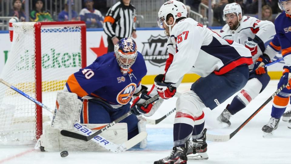 Mar 11, 2023; Elmont, New York, USA; New York Islanders goaltender Semyon Varlamov (40) stops Washington Capitals defenseman Trevor van Riemsdyk (57) shot during the first period at UBS Arena.