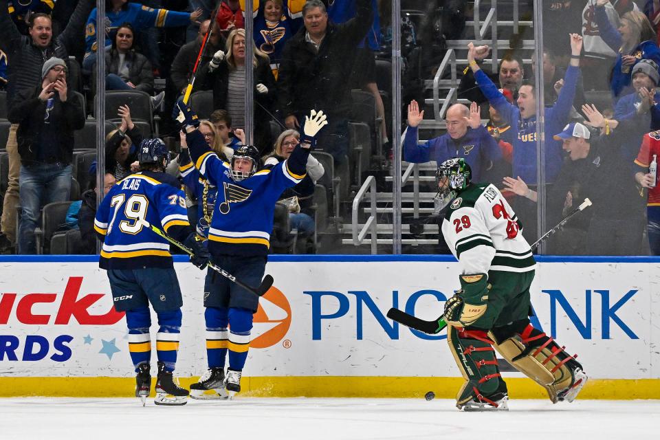 St. Louis Blues left wing Jakub Vrana (15) celebrates with left wing Sammy Blais (79) after scoring against Minnesota Wild goaltender Marc-Andre Fleury (29) during the first period at Enterprise Center in St. Louis, March 15, 2023.
