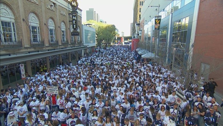 Thousands of Winnipeg Jets fans fill the streets around Bell MTS Centre in 2018.