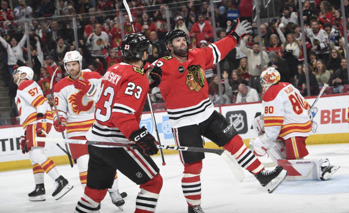 Decimated Blackhawks snap losing streak with win over Flames