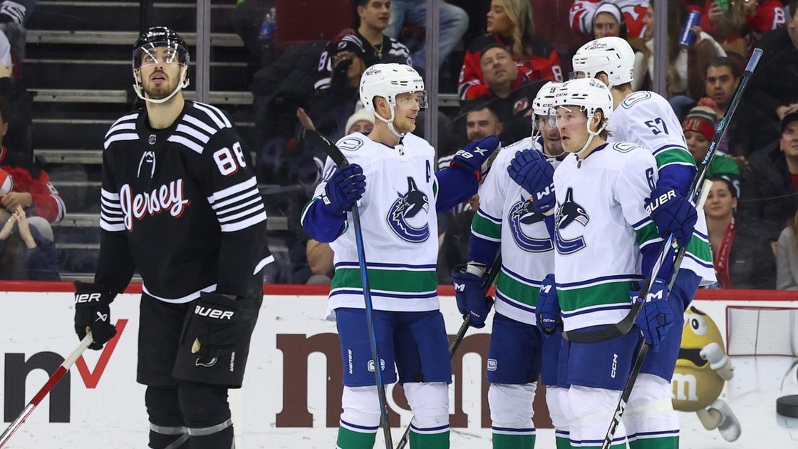 Devils' comeback falls short in 6-4 loss to Canucks