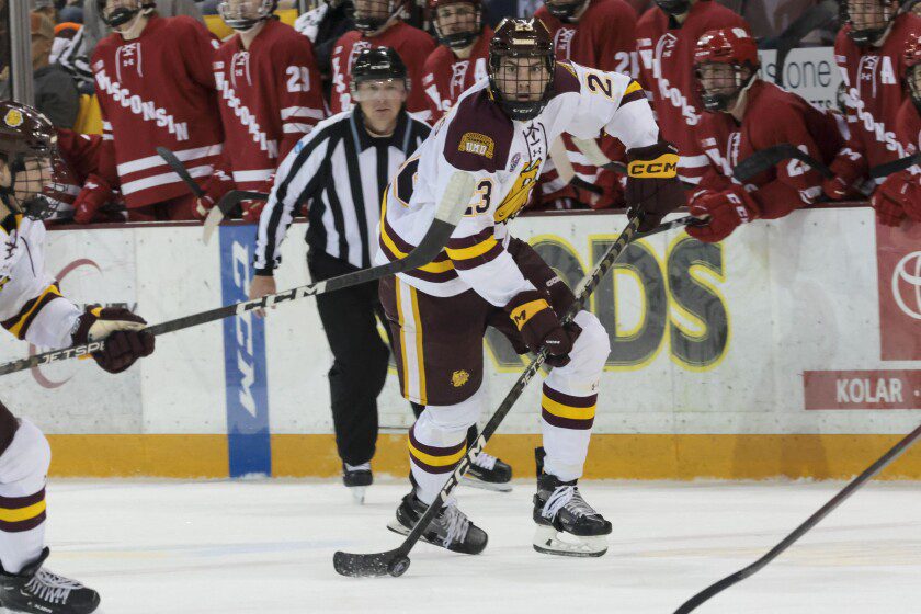 college men playing ice hockey