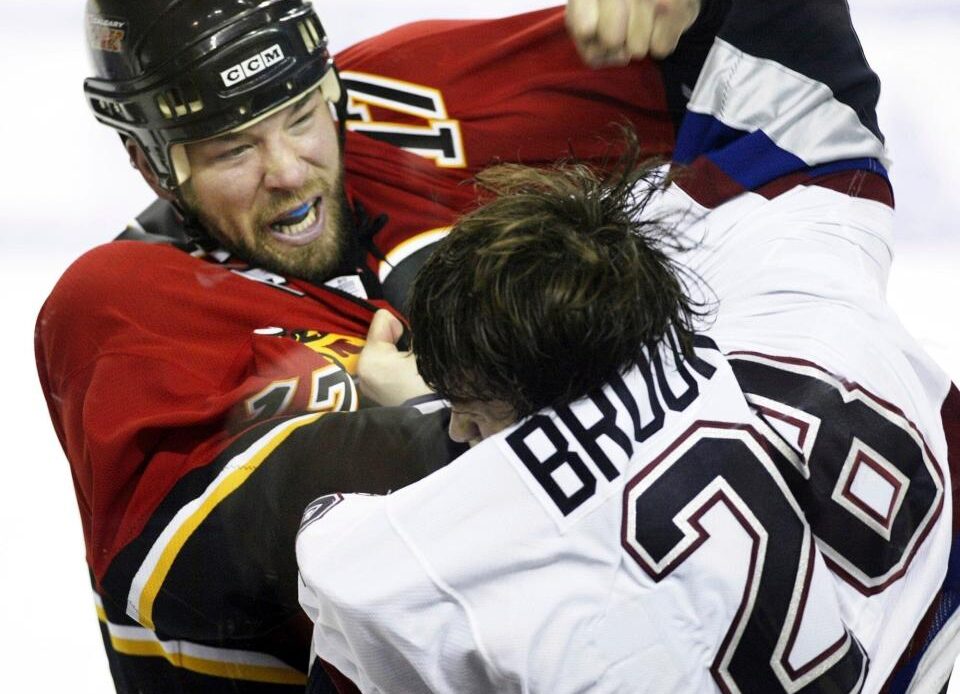 Simon, then of Calgary Flames, fights with Wade Brookbank of Vancouver Canucks in 2006