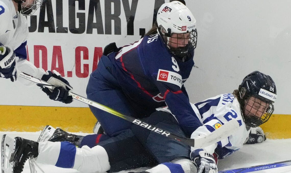 U.S. women advance to world final; ex-Wing Jensen stretchered off ice