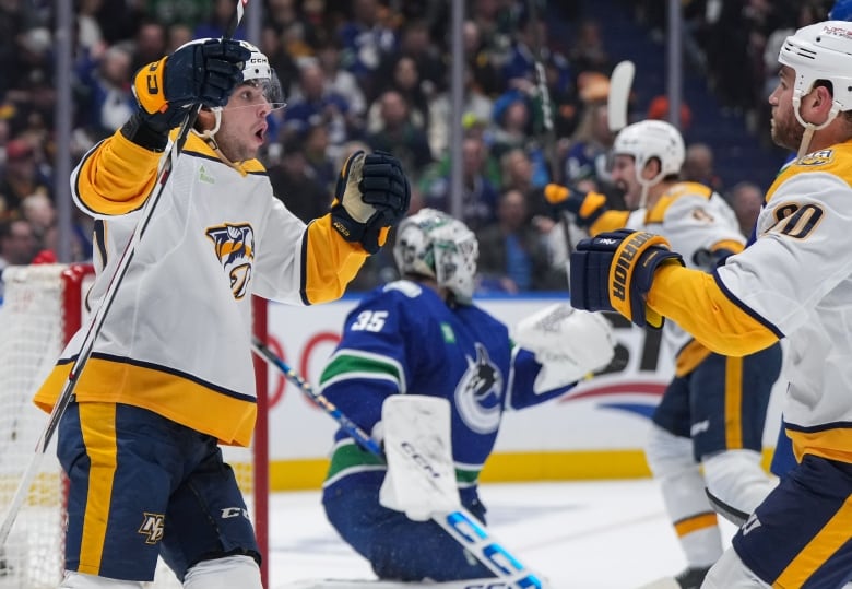 Hockey players celebrate.