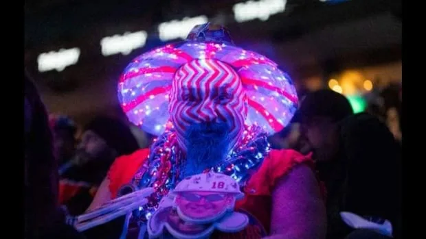 A fan is in costume to cheer on the Oilers,