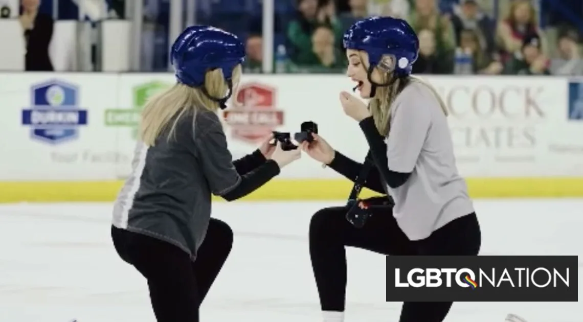 Fans stand & cheer as two women propose during pro-ice hockey game - LGBTQ Nation