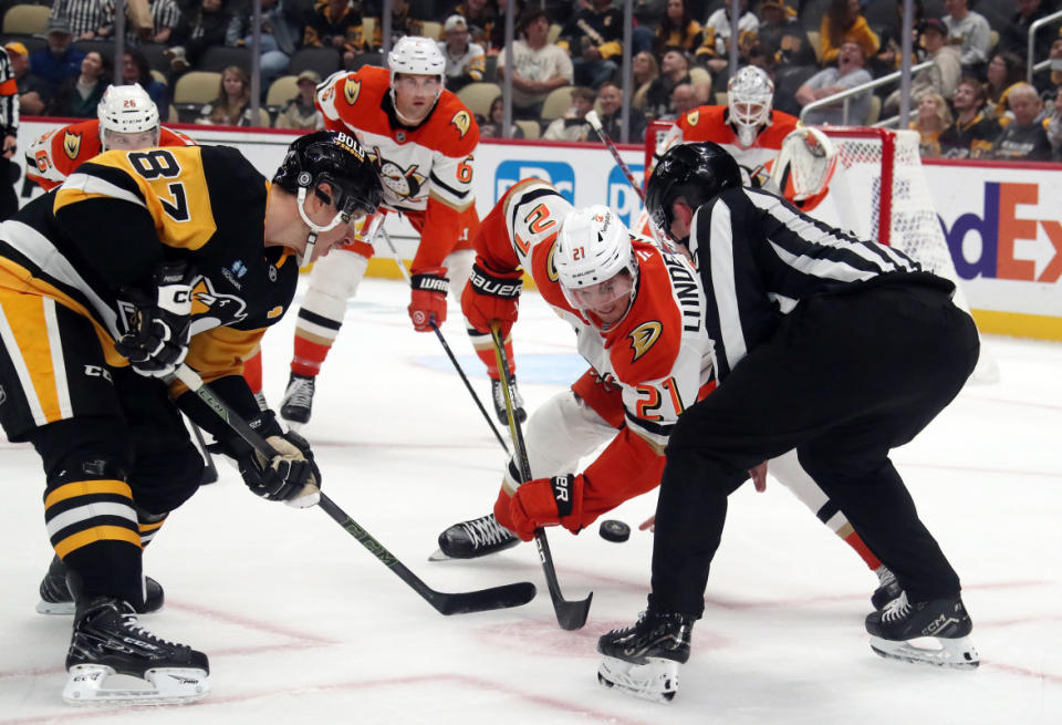 Oct 31, 2024; Pittsburgh, Pennsylvania, USA; Pittsburgh Penguins center Sidney Crosby (87) and Anaheim Ducks center Isac Lundestrom (21) take a face-off during the third period at PPG Paints Arena. Mandatory Credit: Charles LeClaire-Imagn Images<p>Charles LeClaire-Imagn Images</p>