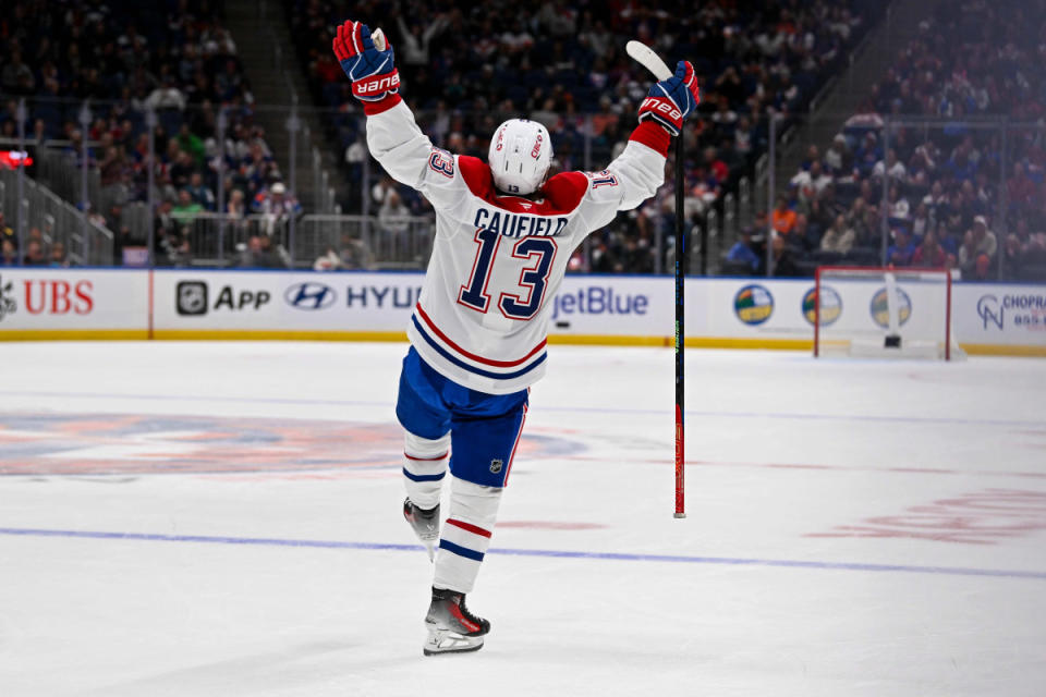 Oct 19, 2024; Elmont, New York, USA; Montreal Canadiens right wing Cole Caufield (13) celebrates his goal against the New York Islanders during the third period at UBS Arena. Mandatory Credit: Dennis Schneidler-Imagn Images