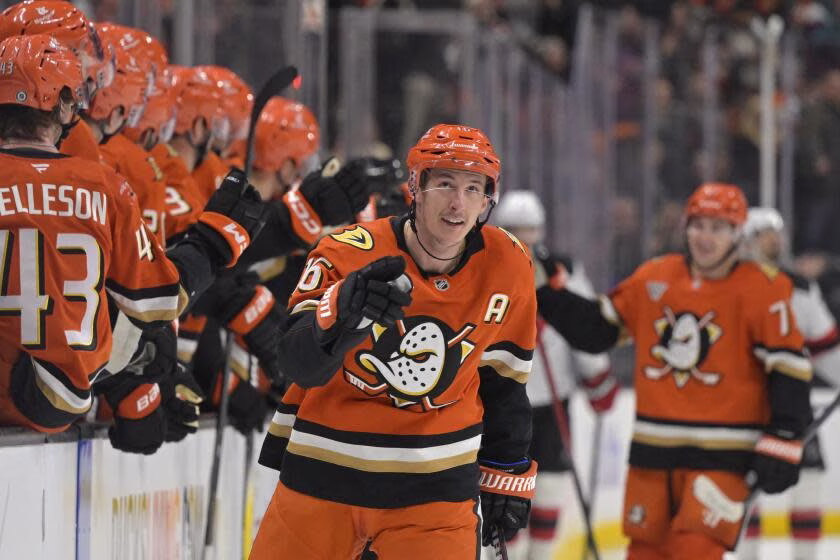 Ducks center Ryan Stromeis is congratulated at the bench after scoring a goal against the New Jersey Devils Tuesday.