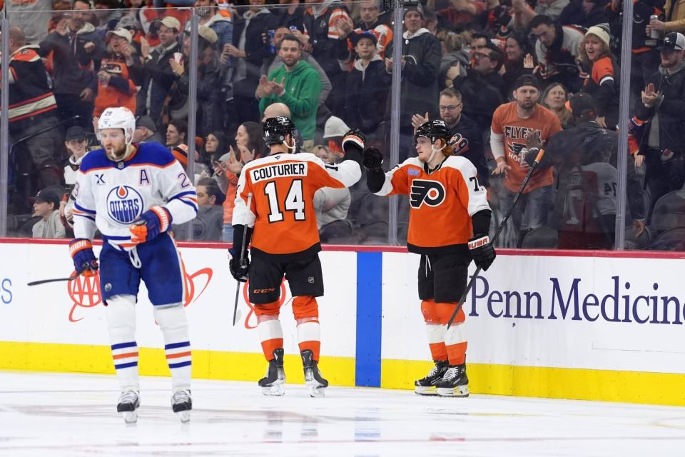 Owen Tippett and Sean Couturier celebrate their goal. (Kyle Ross-Imagn Images)