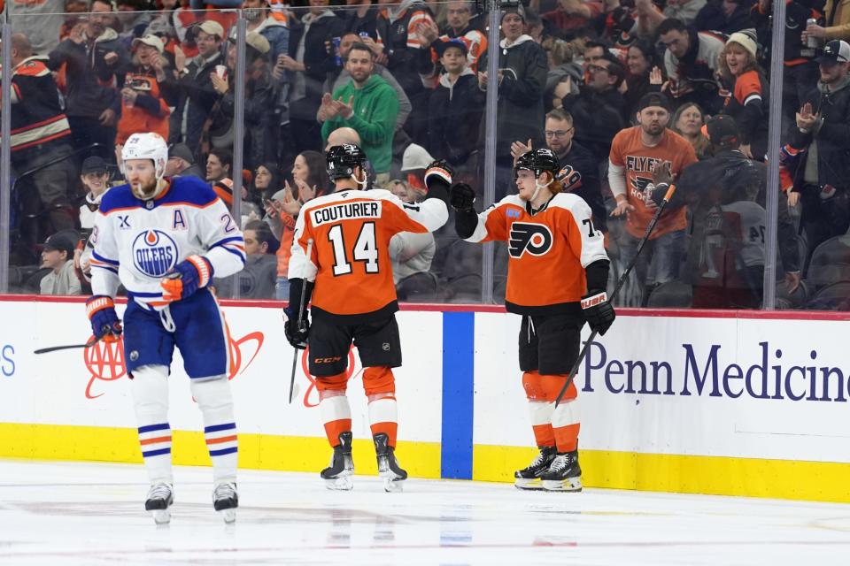 Owen Tippett and Sean Couturier celebrate their goal. (Kyle Ross-Imagn Images)