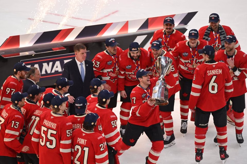 Feb 20, 2025; Boston, MA, USA; Team Canada forward Sidney Crosby (87) lifts the 4 Nations Face-Off trophy after winning against Team USA in overtime during the 4 Nations Face-Off ice hockey championship game at TD Garden. (Brian Fluharty-Imagn Images)