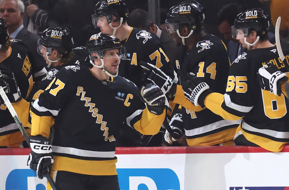 Mar 11, 2025; Pittsburgh, Pennsylvania, USA; Pittsburgh Penguins center Sidney Crosby (87) celebrates his second goal of the game with the Penguins bench against the Vegas Golden Knights during the second period at PPG Paints Arena. (Charles LeClaire-Imagn Images)