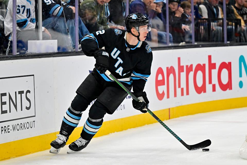 Jan 11, 2025; Salt Lake City, Utah, USA; Utah Hockey Club defenseman Olli Maatta (2) moves the puck against the New York Islanders during first period at the Delta Center. Mandatory Credit: Christopher Creveling-Imagn Images