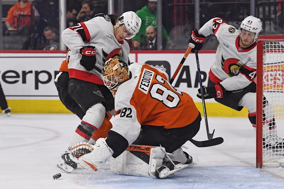 Mar 11, 2025; Philadelphia, Pennsylvania; Philadelphia Flyers goaltender Ivan Fedotov (82) makes a save against Ottawa Senators center Ridly Greig (71). Credit: Eric Hartline-Imagn Images